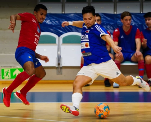 futsal player ready to hit the ball
