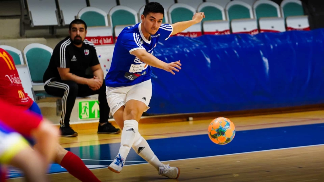 futsal player just hit the ball