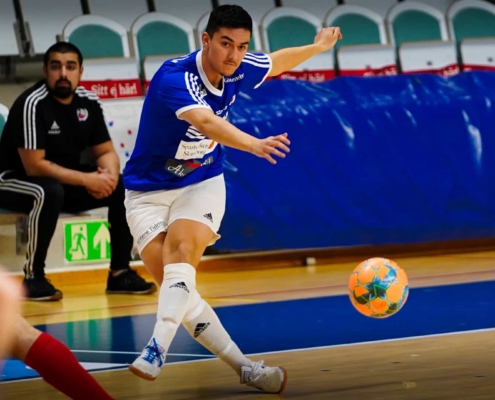 futsal player just hit the ball