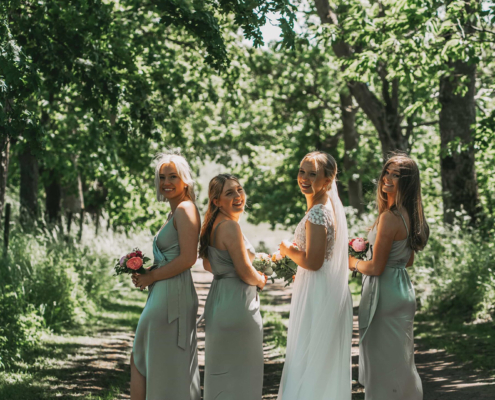 wedding bride with bridesmaids in a forest