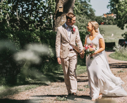 wedding couple walking in the sun