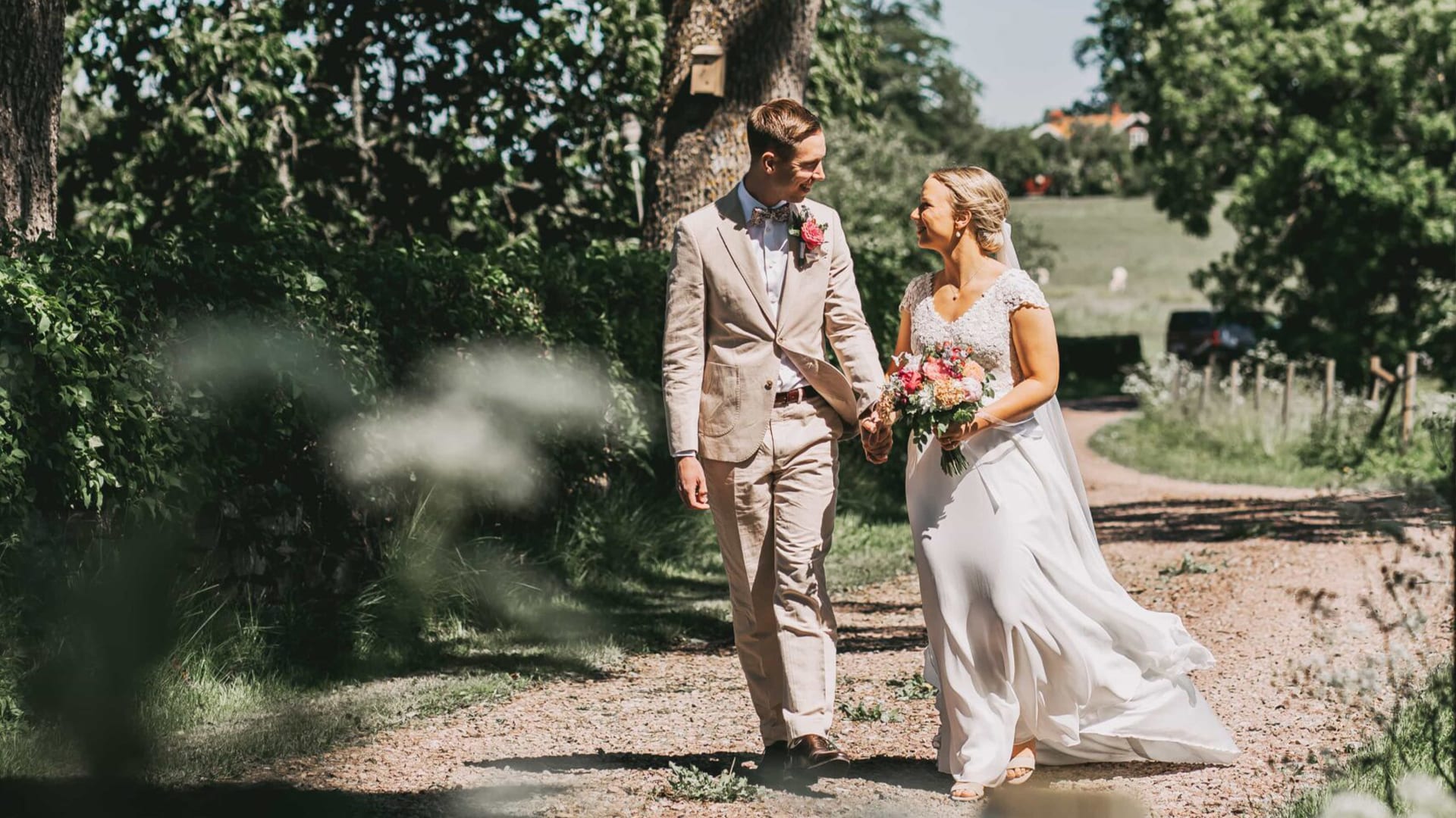 wedding couple walking in the sun