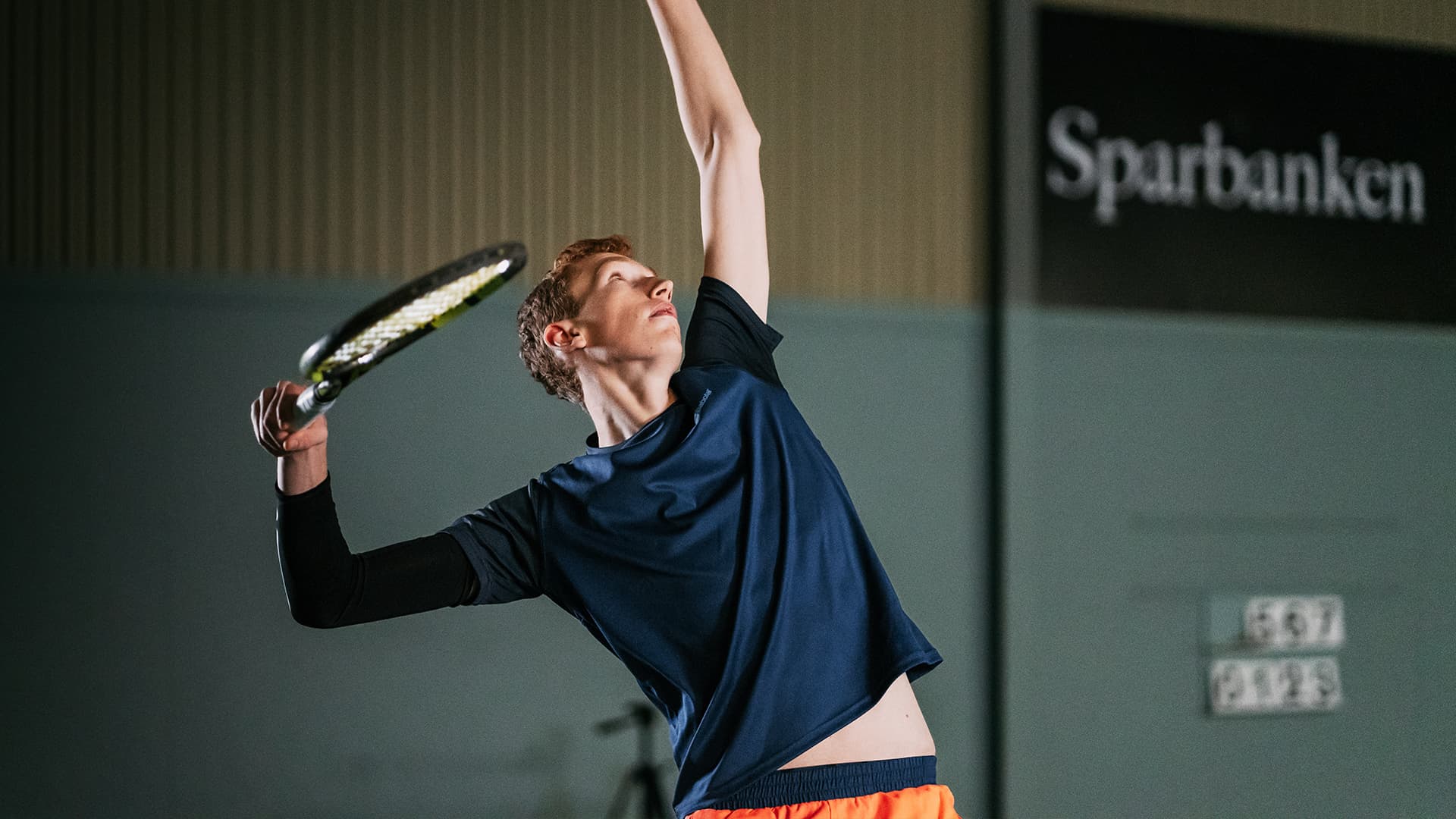 tennis player doing a serve