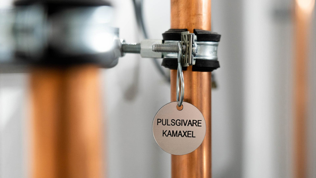 close up of a tag on a pipe
