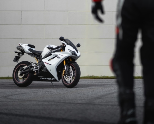 Sportbike with a person out of focus in frame