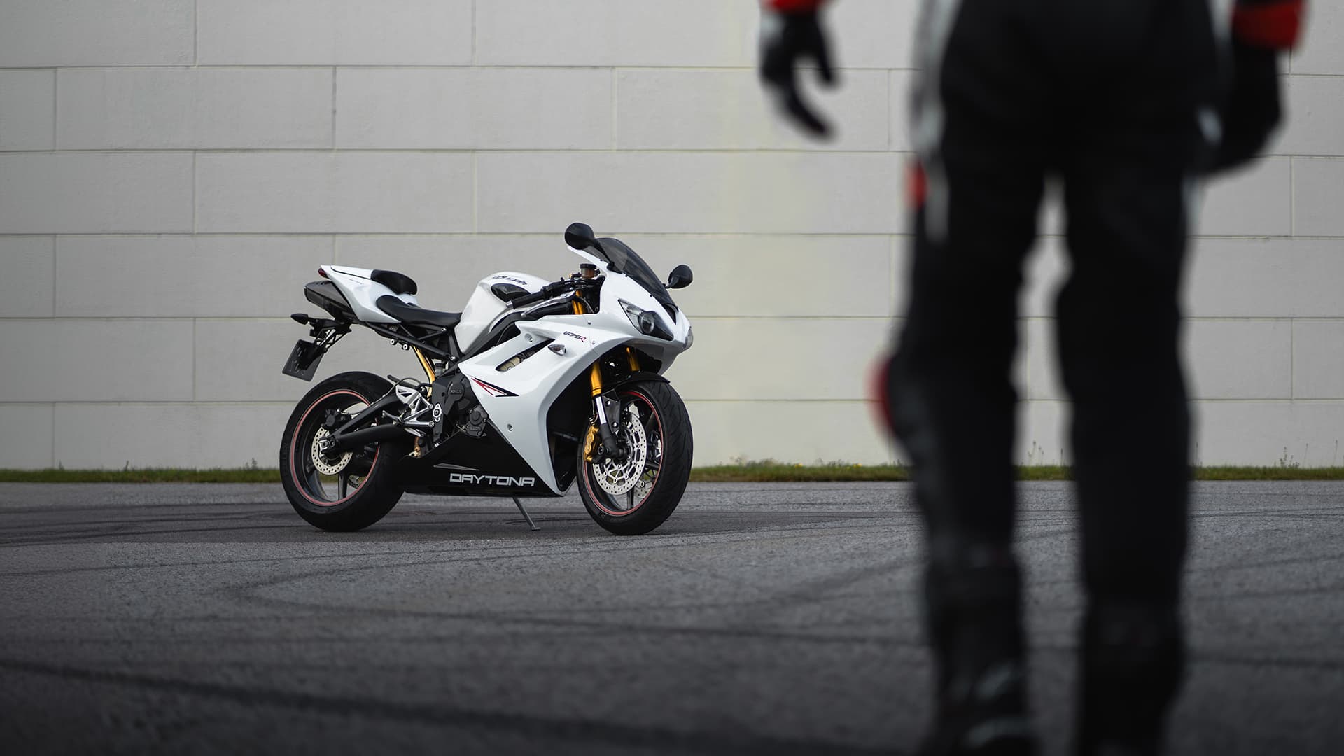 Sportbike with a person out of focus in frame
