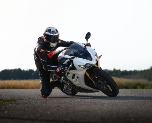 Person driving a sportbike during sunset