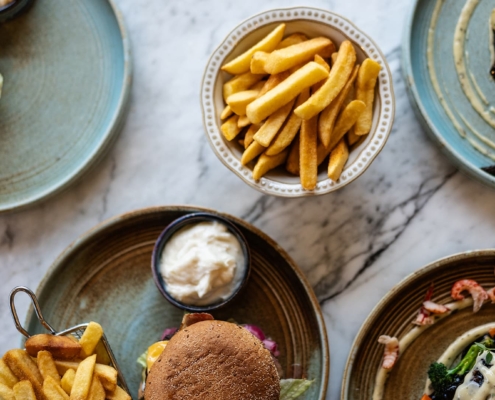 overlay shot of a table with food in a restaurant