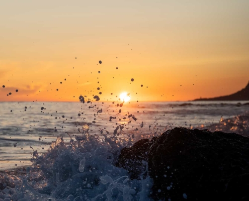 Wave splashing during midnight sun in Lofoten