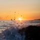 Wave splashing during midnight sun in Lofoten