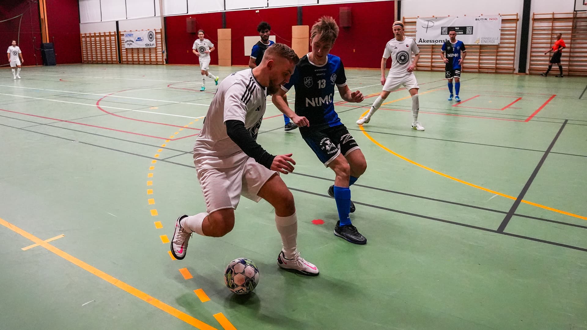 futsal player covering the ball during a game