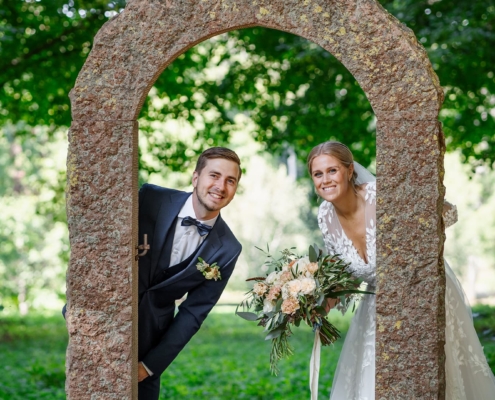 bride and groom happily in an outdoor environment