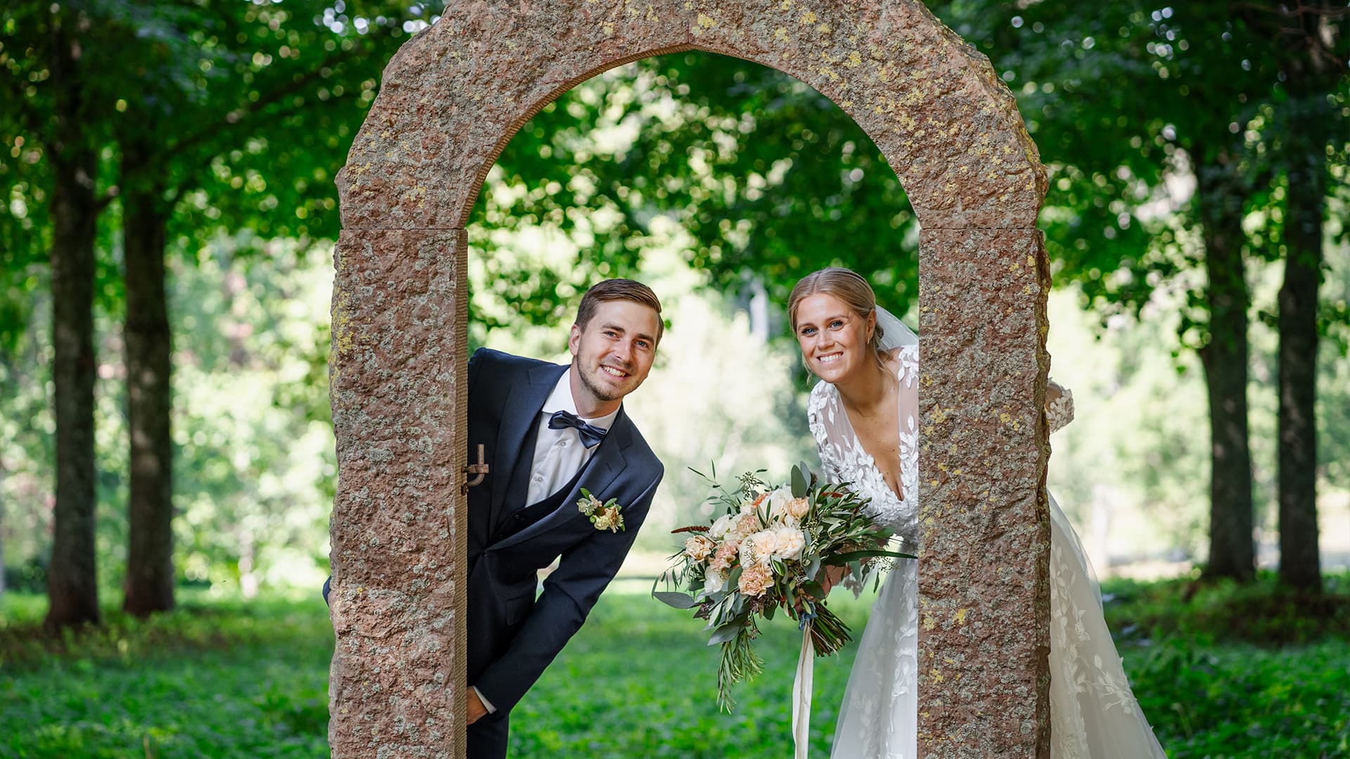 bride and groom happily in an outdoor environment