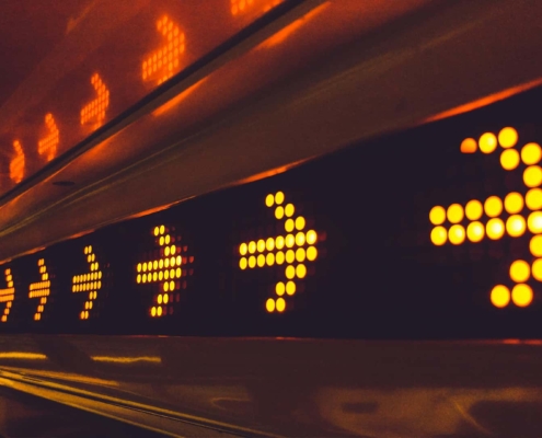 multiple yellow arrows in a tunnel