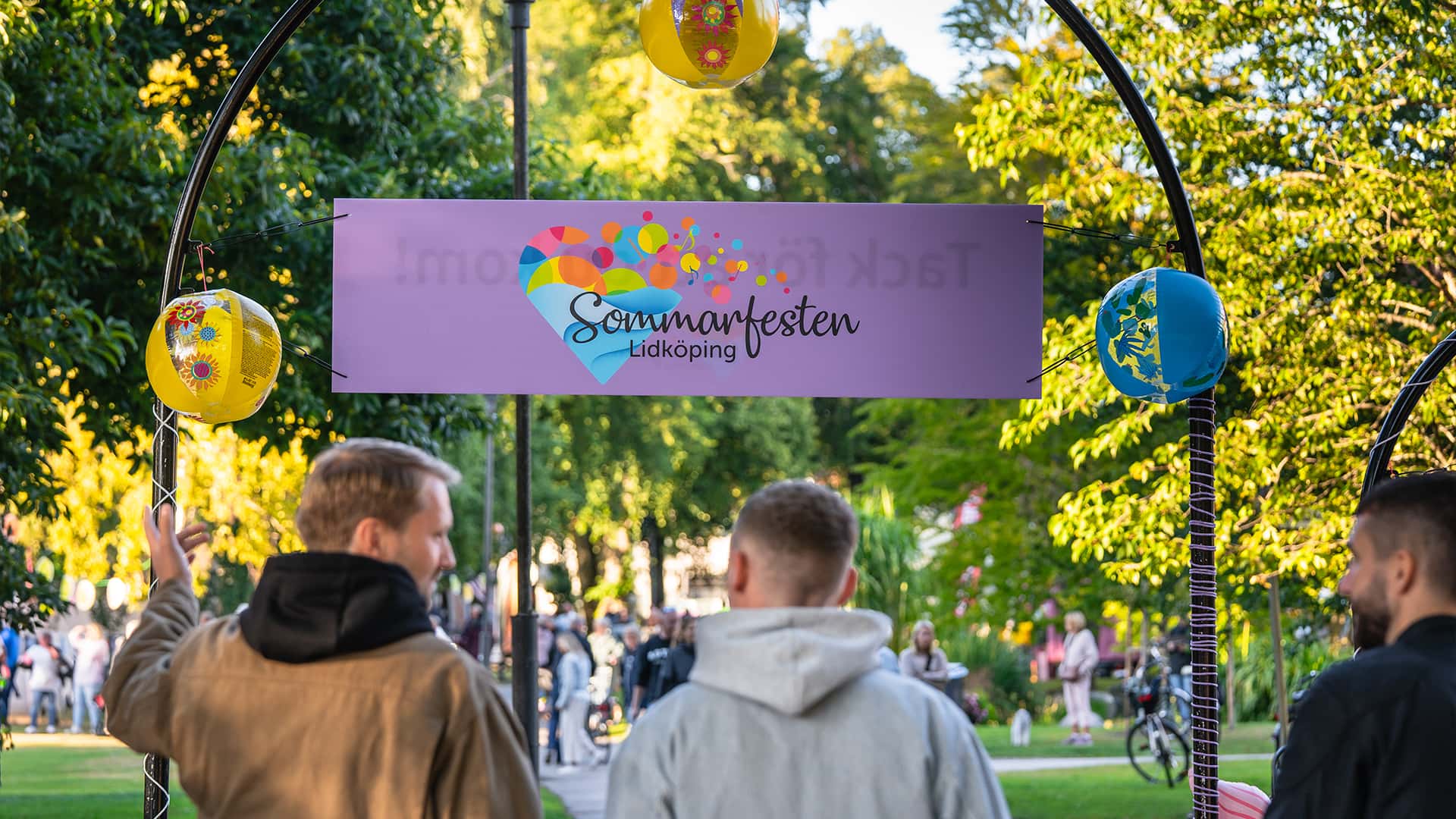 a group of friends walking towards an event entrance