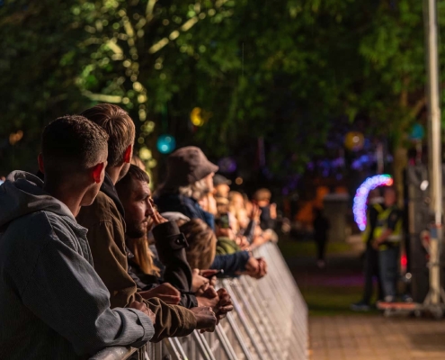 crowds in the front row at an evening concert