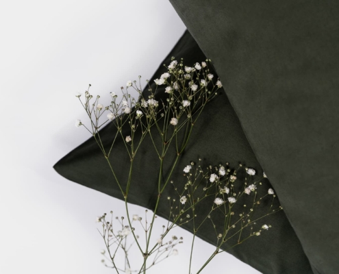 close up of flowers on two pillows