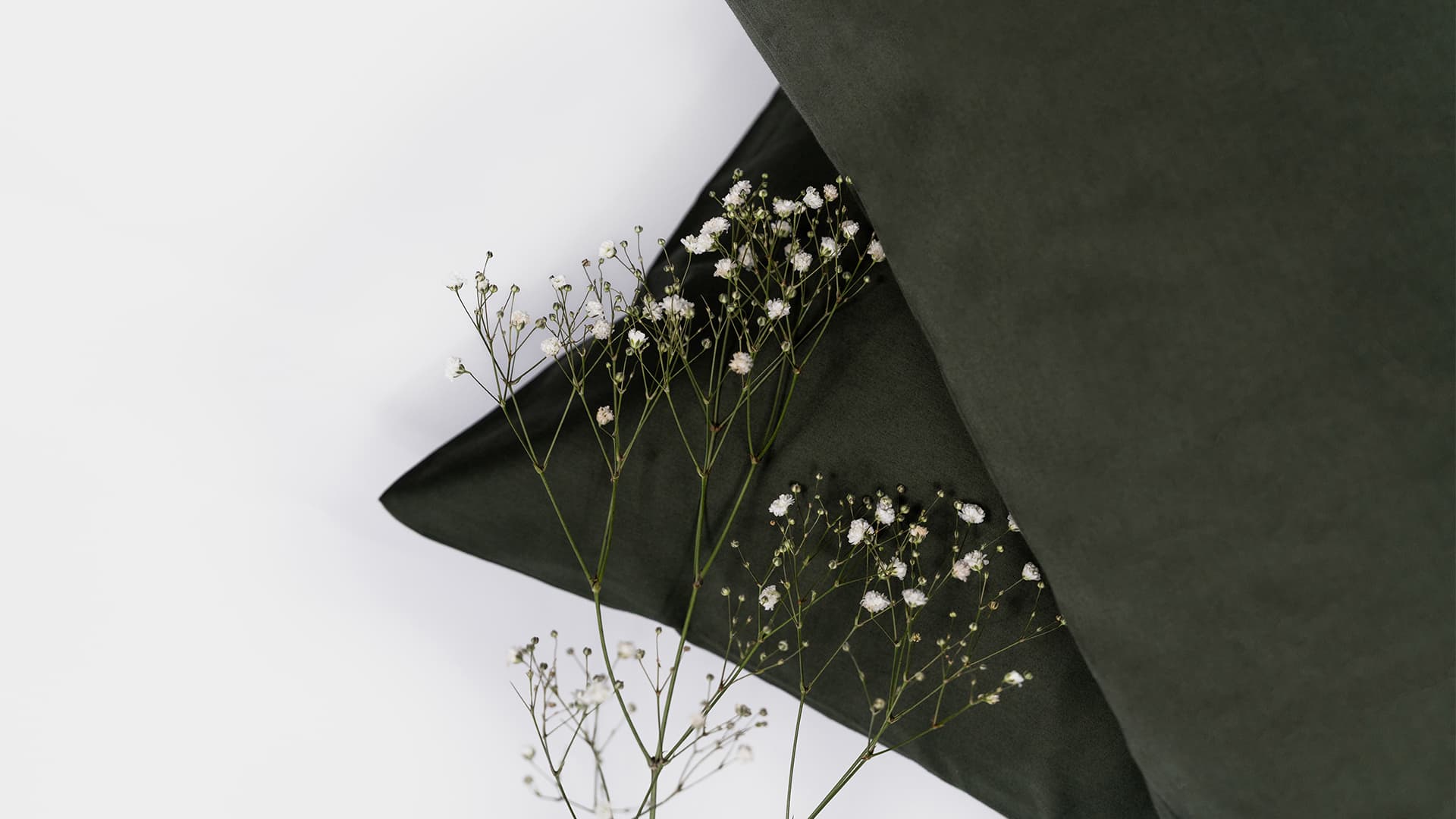 close up of flowers on two pillows
